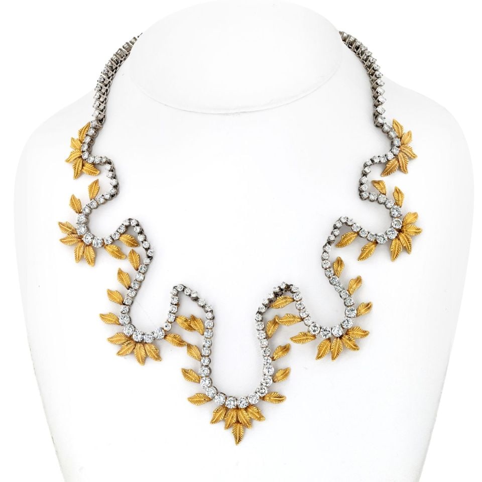 Stunning 28 Carat Diamond Leaf Necklace in Platinum and 18K Yellow Gold: Stunning 28 Carat Diamond Leaf Necklace in Platinum and 18K Yellow Gold This exquisite necklace features a stunning combination of platinum and 18K yellow gold, beautifully crafted into a delicate lea