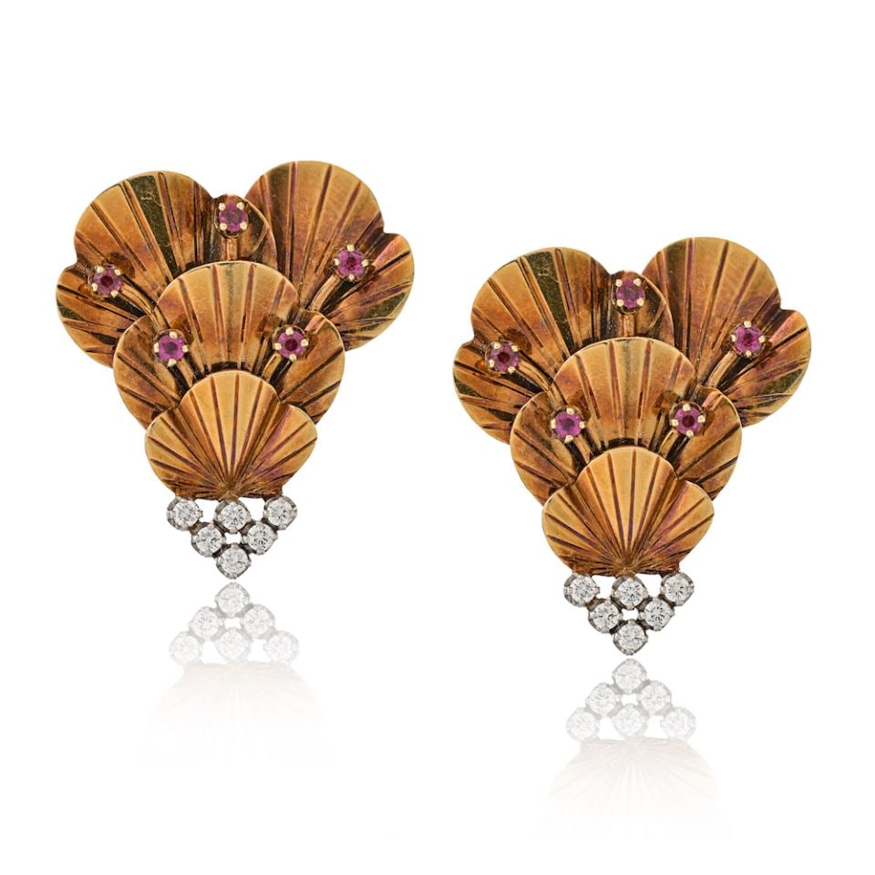 Tiffany & Co. Retro Clip Brooch in Platinum 14K Gold with Diamonds Rubies 1940s: Tiffany & Co. Retro Clip Brooch in Platinum 14K Gold with Diamonds Rubies 1940s This exquisite Tiffany & Co. Retro Clip Brooch showcases a stunning design inspired by the vintage aesthetic of the 1940