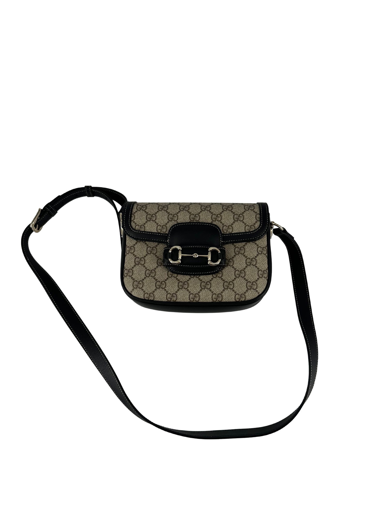 Black Canvas Gucci Horsebit Shoulder Bag from Italy: Black Canvas Gucci Horsebit Shoulder Bag from Italy This Gucci Horsebit bag features a black canvas exterior and is designed for universal use. Made in Italy, it is in un-used condition both inside an
