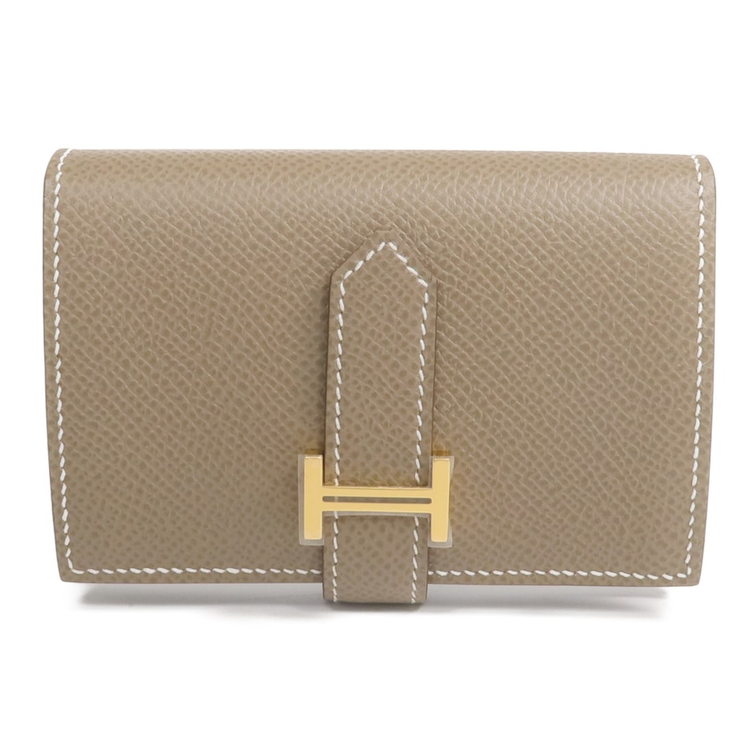 Hermes Bearn Mini Etoupe Epsom Leather Bi-Fold Wallet with Gold Hardware: Hermes Bearn Mini Etoupe Epsom Leather Bi-Fold Wallet with Gold Hardware This bi-fold wallet is crafted from Epsom calfskin leather in a sophisticated gray shade. Featuring gold tone hardware, it is d