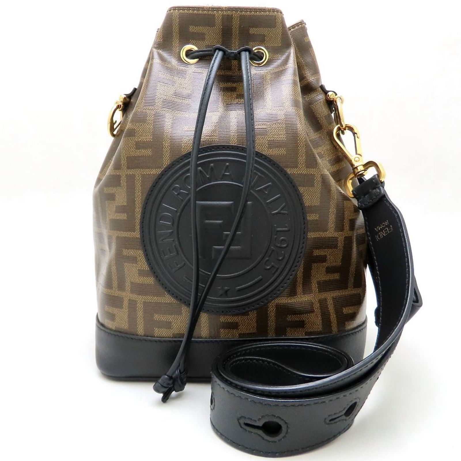 Brown Canvas Fendi Mon Tresor Bucket Bag Made in Italy: Brown Canvas Fendi Mon Tresor Bucket Bag Made in Italy The Fendi Mon Tresor is a women's bucket bag crafted from brown canvas. It features a spacious interior and is designed with careful attention to
