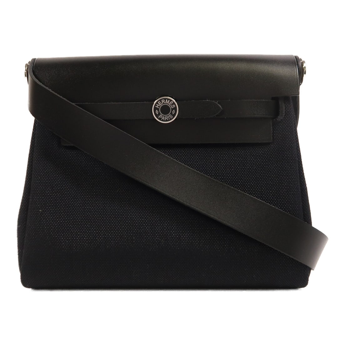 Hermes Mini Herbag Black Canvas Shoulder Bag France: Hermes Mini Herbag Black Canvas Shoulder Bag France This Hermes Mini Herbag shoulder bag features a black canvas exterior and a compact silhouette. Crafted in France, it is designed for everyday use w