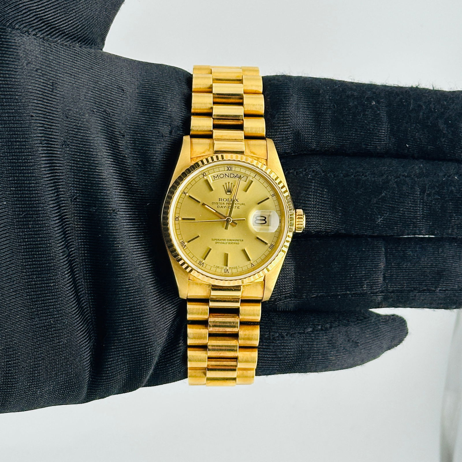Rolex 18038 Day-Date President Watch Champagne Stick Dial with Papers 1988: Rolex 18038 Day-Date President Watch Champagne Stick Dial with Papers 1988 This Rolex Day-Date features a champagne stick dial and comes with a President bracelet. The watch has a fluted bezel and is