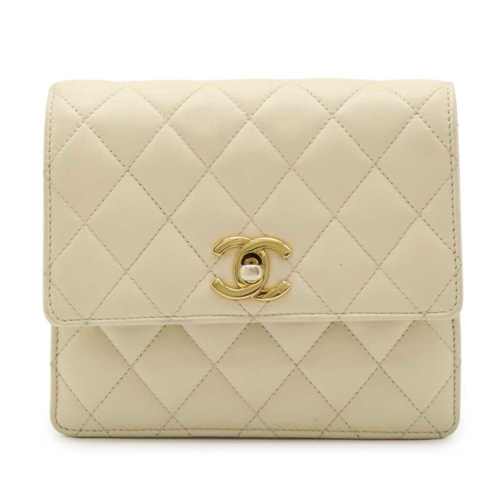 Chanel Beige Leather Bag Belt Accessory for Women: Chanel Beige Leather Bag Belt Accessory for Women This Chanel bag belt for women features a beige leather exterior and is crafted in Italy. The item shows slight sun damage and minor loss of shape on