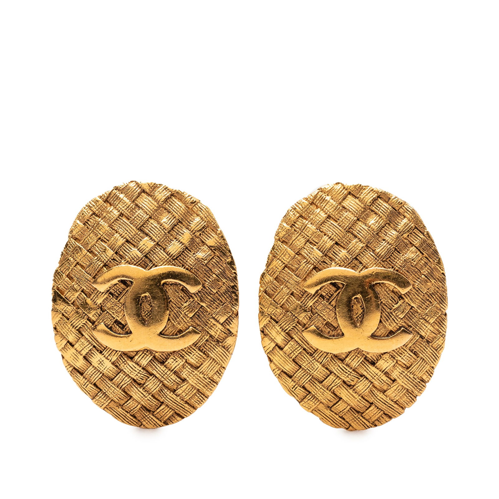 Chanel Gold Plated CC Oval Clip On Metal Earrings: Chanel Gold Plated CC Oval Clip On Metal Earrings These Chanel clip-on earrings feature a gold plated metal body with an oval shape and the signature CC design. Crafted in France, they are designed fo