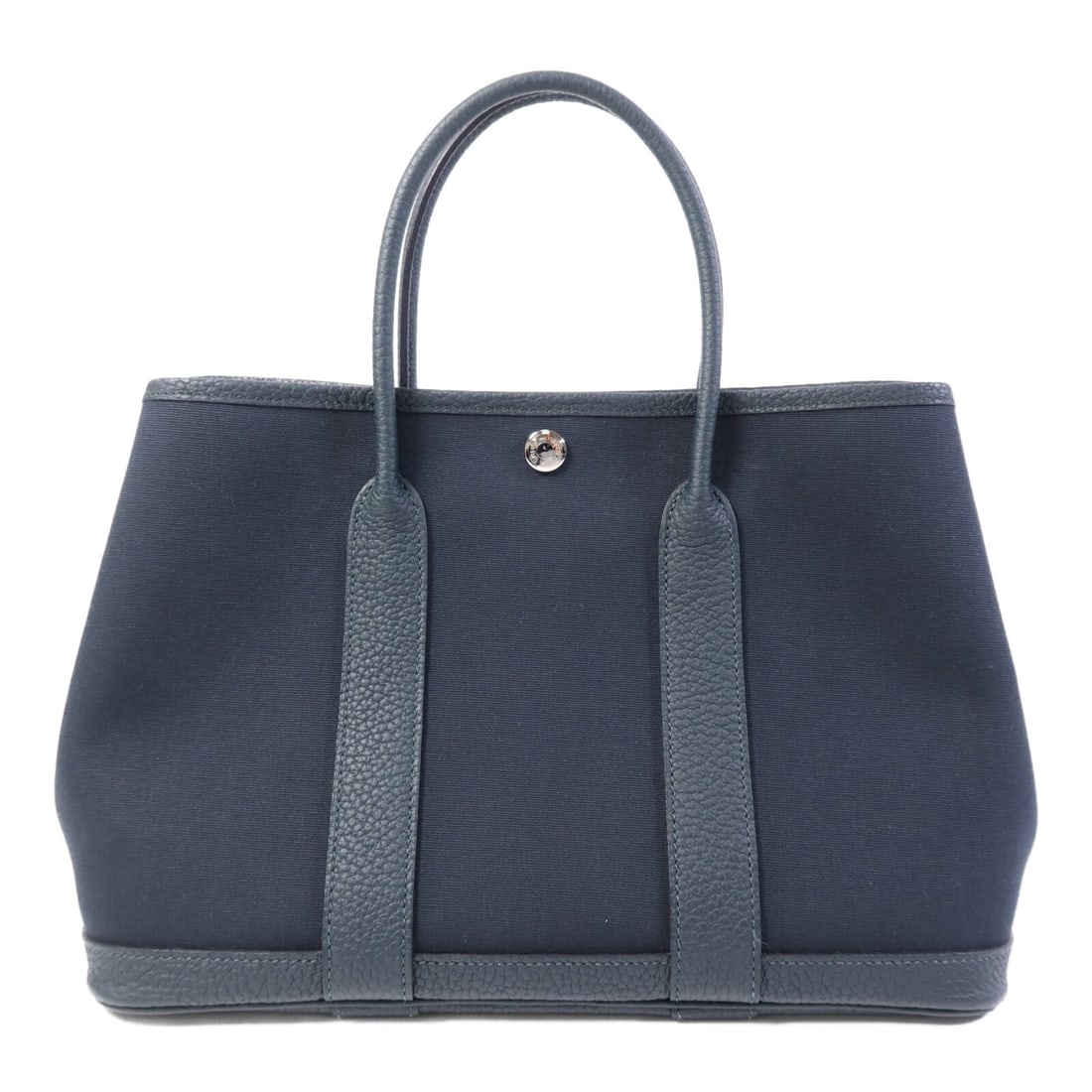 Hermes Garden Party TPM Green Canvas Tote Bag with Palladium Hardware: Hermes Garden Party TPM Green Canvas Tote Bag with Palladium Hardware This Hermes Garden Party TPM tote bag features a durable green canvas exterior in Vert Cypres and Vert Olive. Crafted in France, t
