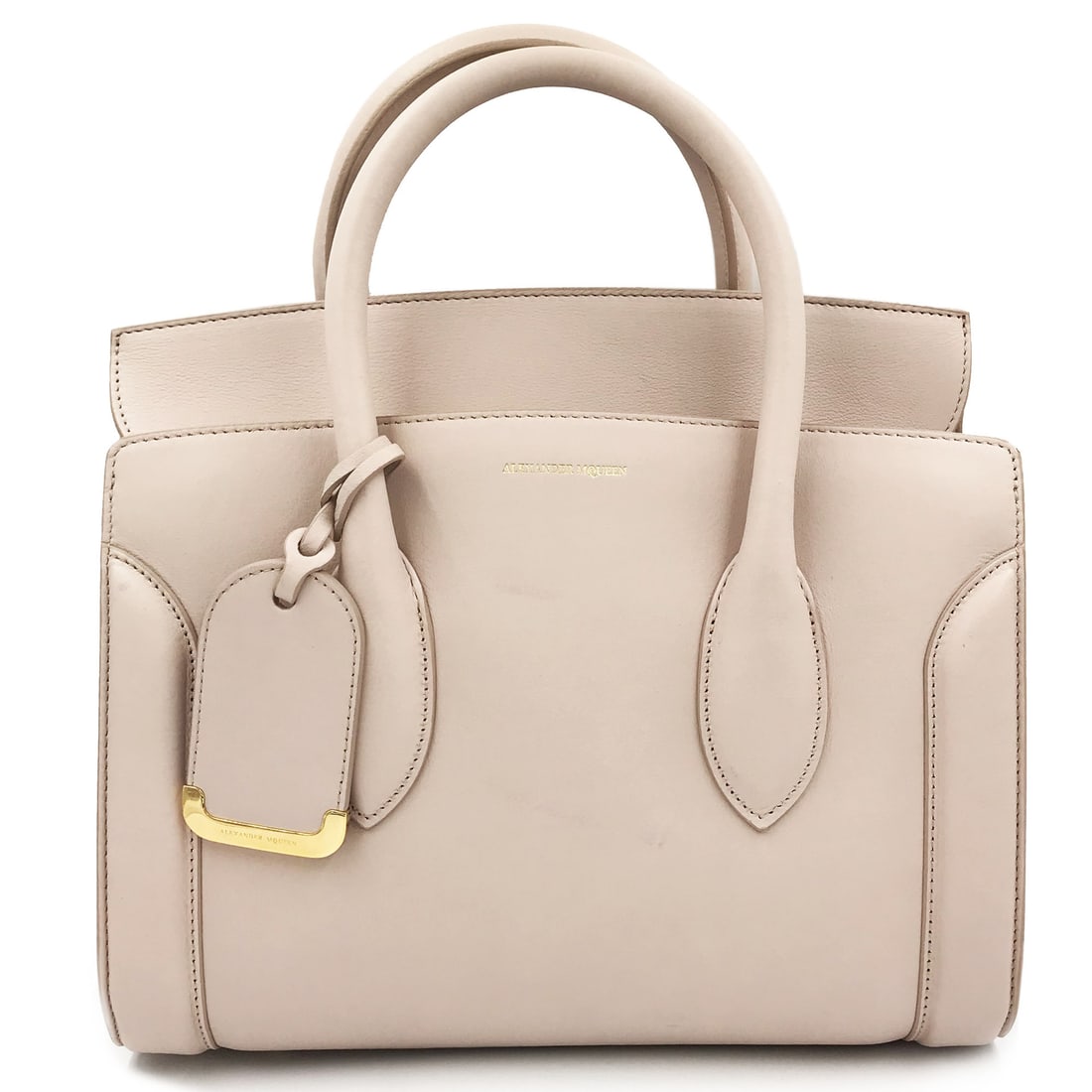 Alexander McQueen Heroine 30 Nude Leather Tote with Adjustable Strap: Alexander McQueen Heroine 30 Nude Leather Tote with Adjustable Strap Elevate your style with the Alexander McQueen Heroine 30 Medium Leather Shoulder Bag in a chic nude hue. This sophisticated tote