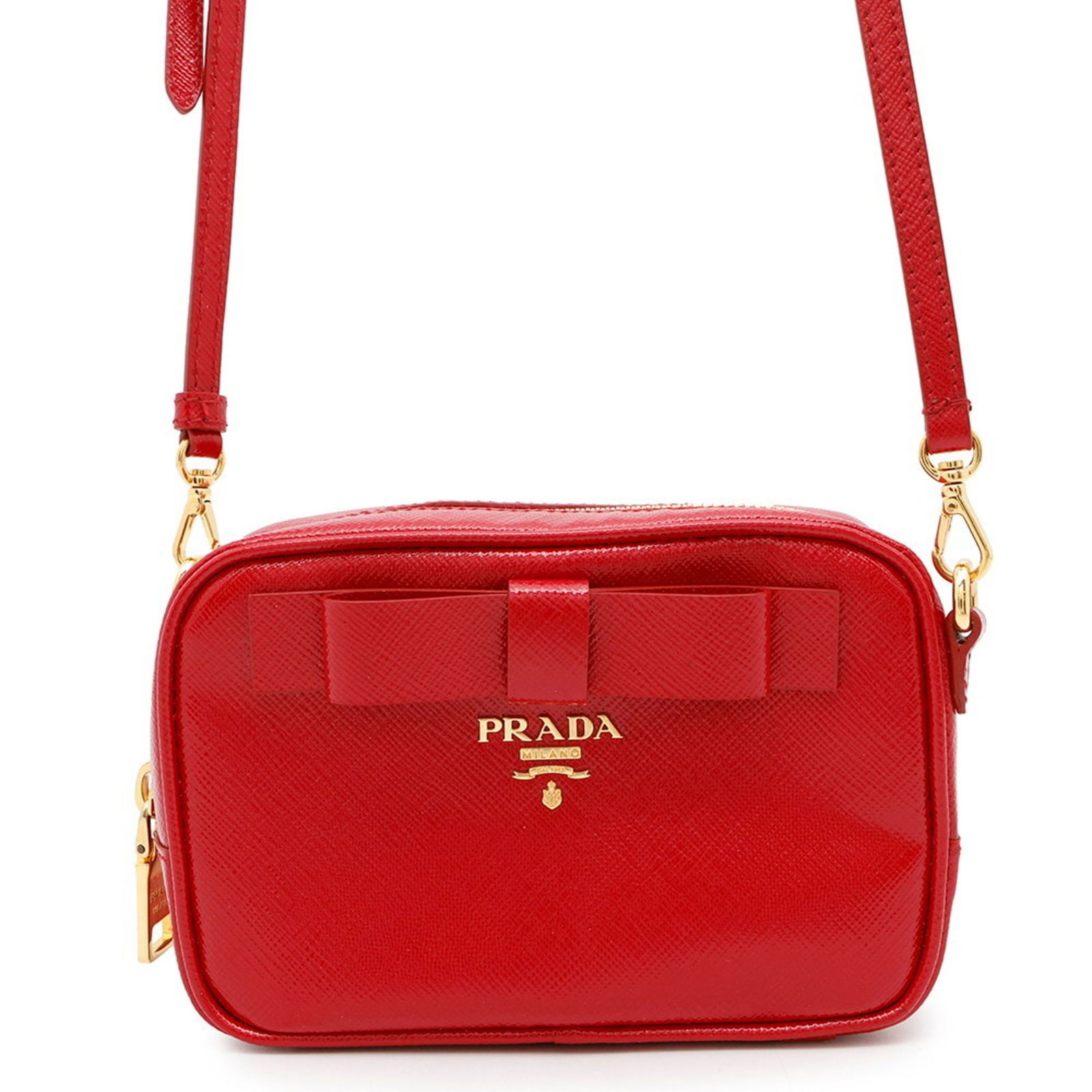 Prada Ribbon Red Leather Crossbody Bag with Adjustable Strap: Prada Ribbon Red Leather Crossbody Bag with Adjustable Strap This Prada Ribbon bag features a vibrant red leather exterior, complemented by an adjustable strap for versatile carrying options. Designed