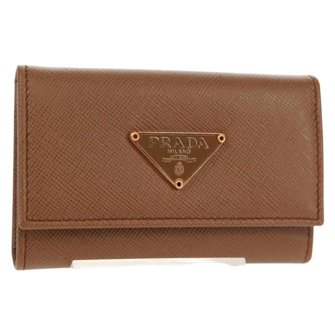 PRADA Brown Saffiano Leather Key Case Made in Italy: PRADA Brown Saffiano Leather Key Case Made in Italy This PRADA Key Case is a stylish and practical accessory crafted from high-quality Saffiano leather in a rich brown color. Made in Italy, it feature