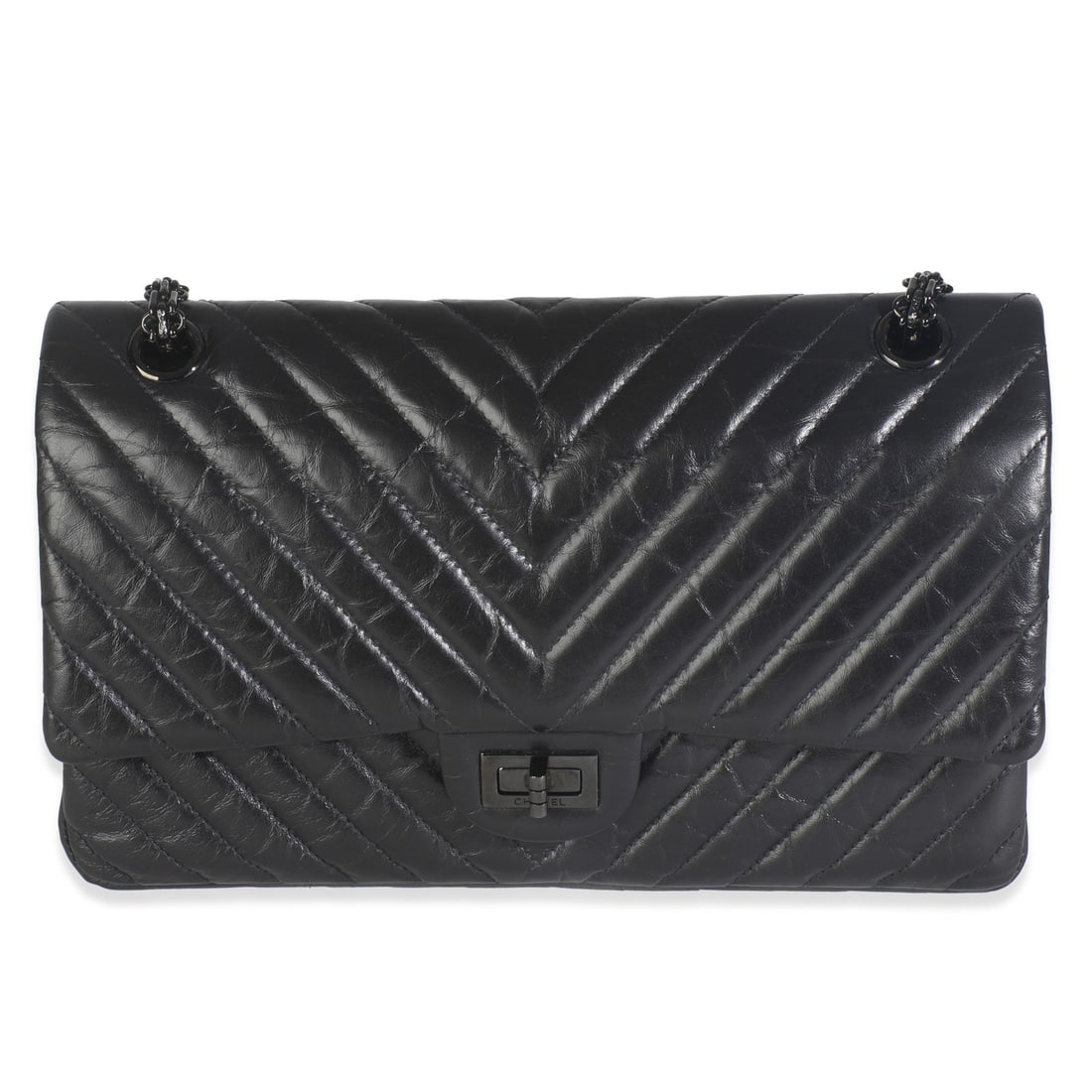 Chanel Black Aged Calfskin Chevron Reissue 226 Flap Shoulder Bag: Chanel Black Aged Calfskin Chevron Reissue 226 Flap Shoulder Bag Elevate your style with this Chanel Black Aged Calfskin Chevron 2.55 So Black Reissue 226 Flap Bag. Crafted in Italy, this sophisticate