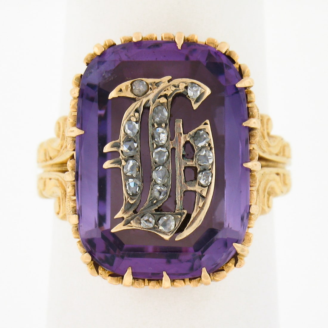 Vintage 18k Yellow Gold Amethyst Diamond Cocktail Ring with Old English Letter: Vintage 18k Yellow Gold Amethyst Diamond Cocktail Ring with Old English Letter This exquisite vintage cocktail ring is crafted from solid 18k yellow gold and features a stunning elongated cushion cut