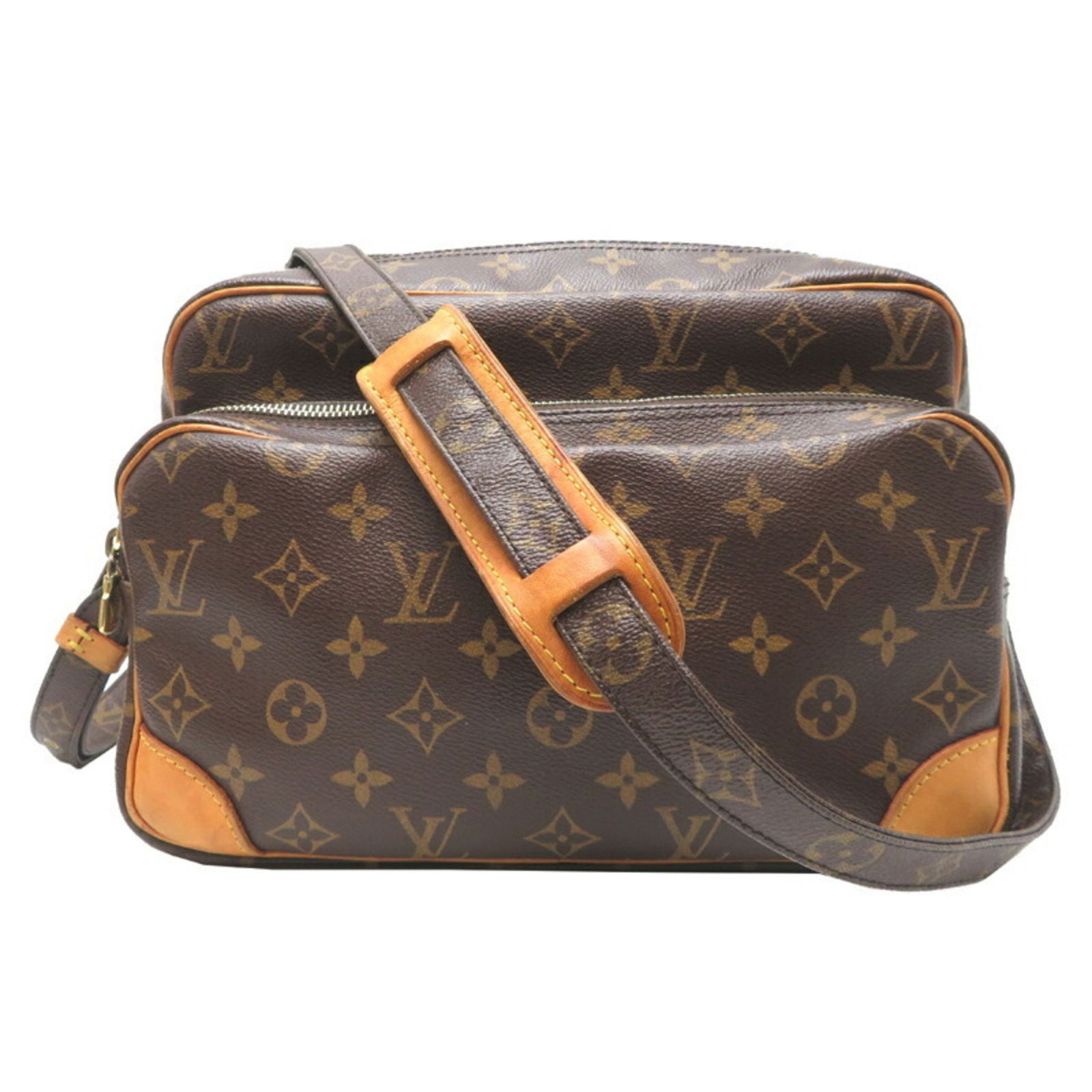 Nile Crossbody Bag in Brown Canvas by Louis Vuitton: Nile Crossbody Bag in Brown Canvas by Louis Vuitton The Louis Vuitton Nile is a brown canvas shoulder bag crafted in France. It features a classic monogram design and is suitable for all genders. The
