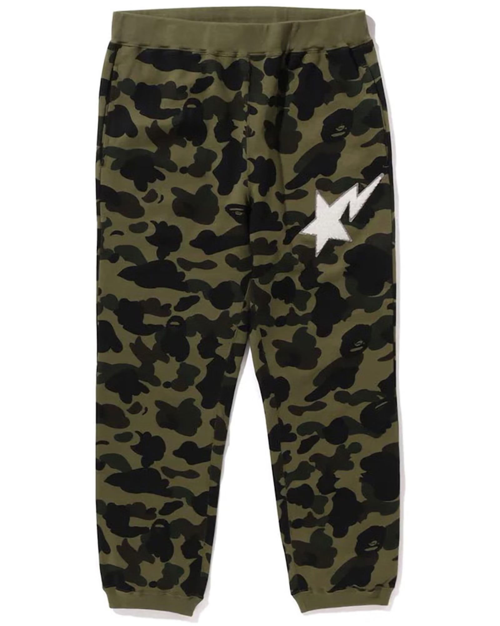 A Bathing Ape Shark Sweatpants 1st Camo Green XL: A Bathing Ape Shark Sweatpants 1st Camo Green XL These sweatpants feature the signature Bape 1st Camo Shark design in a green colorway. They are an extra large size, offering a comfortable and stylish