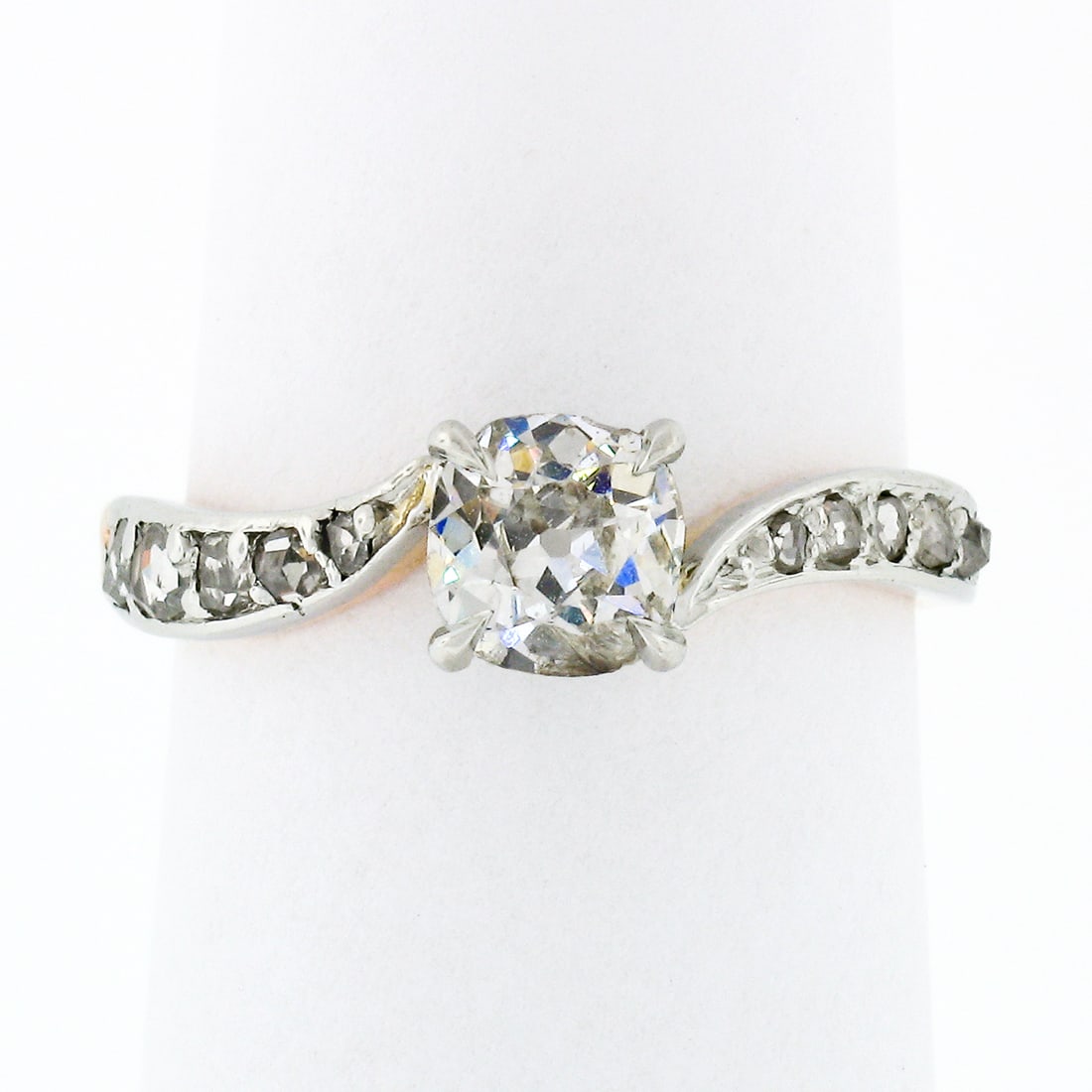 Edwardian 18K Gold Platinum 0.90ct Diamond Wavy Engagement Ring: Edwardian 18K Gold Platinum 0.90ct Diamond Wavy Engagement Ring This exquisite Antique Edwardian engagement ring is a stunning blend of 18K rosy yellow gold and platinum, showcasing a captivating old