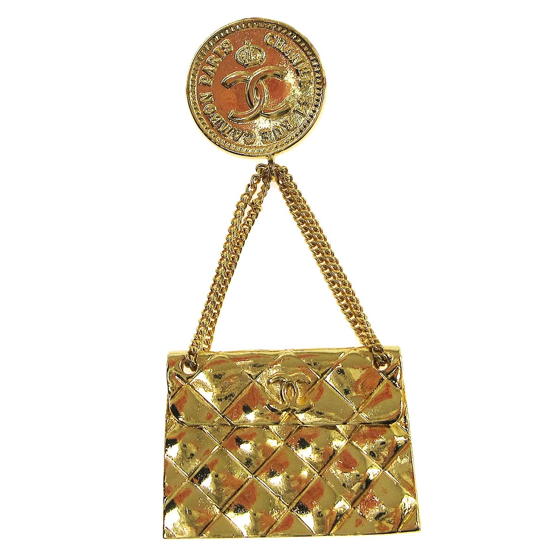 Chanel Gold-Tone Bag Brooch Pin Luxury Fashion Accessory: Chanel Gold-Tone Bag Brooch Pin Luxury Fashion Accessory This exquisite Chanel Bag Brooch Pin is a stylish accessory for any fashion enthusiast. Crafted with a luxurious gold-tone finish, this brooch