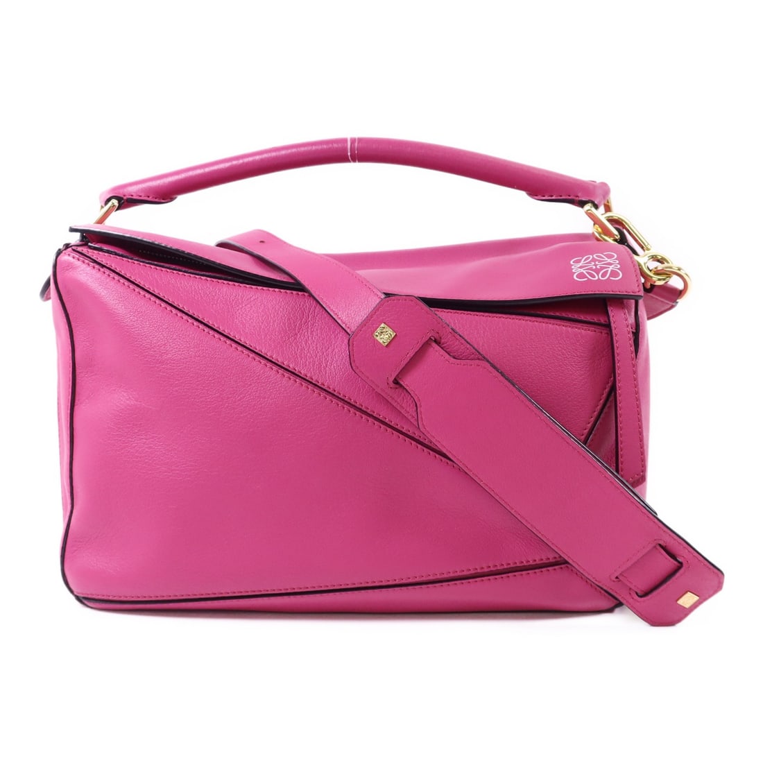 Pink Calfskin Puzzle Shoulder Handbag by Loewe with Gold Hardware: Pink Calfskin Puzzle Shoulder Handbag by Loewe with Gold Hardware This LOEWE Puzzle 2-way shoulder bag is crafted from pink calfskin leather and features a versatile design for use as both a shoulder
