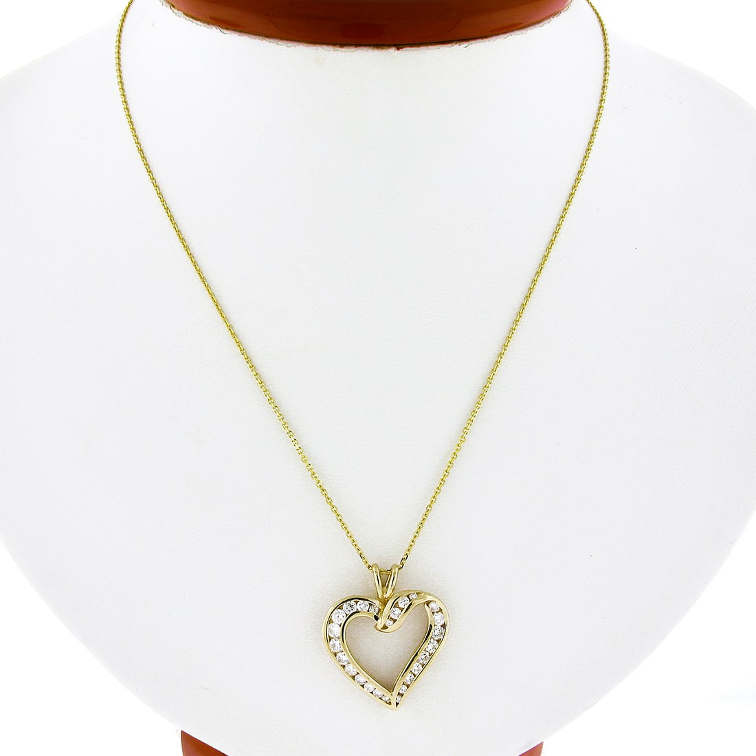 14K Yellow Gold 1ctw Diamond Channel Set Open Heart Pendant Necklace: 14K Yellow Gold 1ctw Diamond Channel Set Open Heart Pendant Necklace This exquisite pendant necklace features a stunning open heart design crafted from solid 14k yellow gold. The heart is elegantly ch