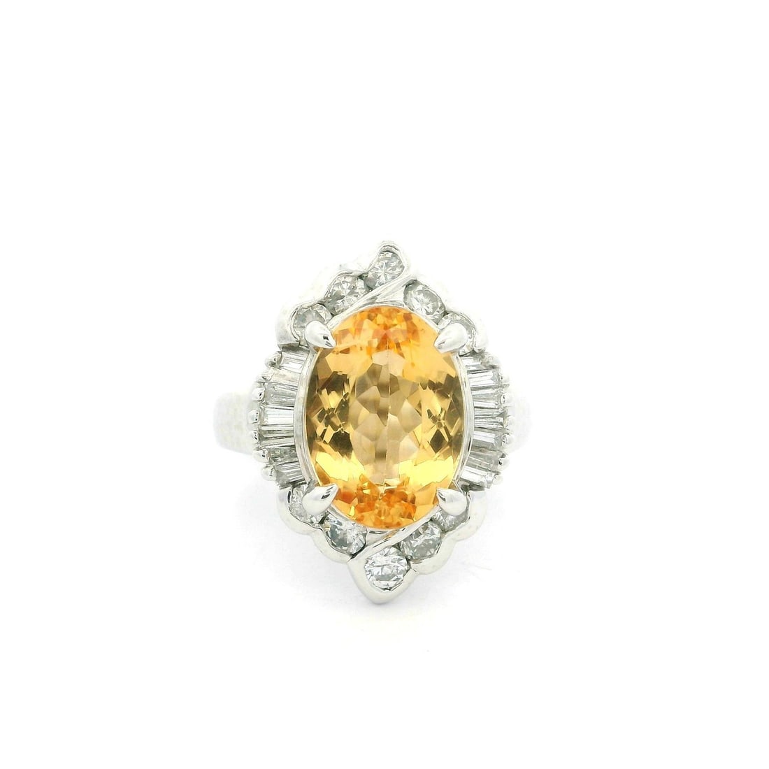 GIA Certified Platinum 5.51ct Imperial Topaz & Diamond Cocktail Ring: GIA Certified Platinum 5.51ct Imperial Topaz & Diamond Cocktail Ring This exquisite cocktail ring features a stunning natural oval brilliant cut Imperial Topaz, showcasing a fiery orangy yellow color,