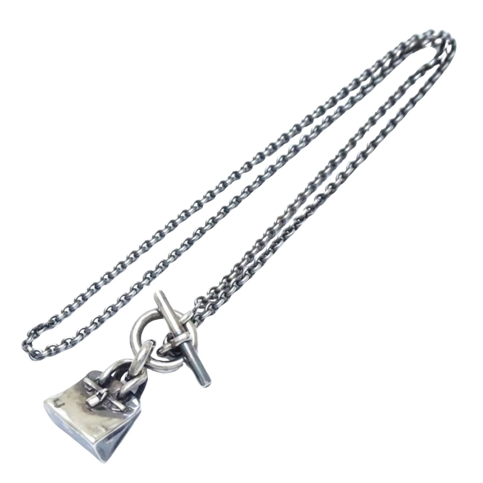 Silver 925 Kelly Pendant Necklace by Hermes Unisex French Design: Silver 925 Kelly Pendant Necklace by Hermes Unisex French Design This Hermes Kelly necklace is crafted from Silver 925 and features a classic design suitable for both women and men. The necklace is in