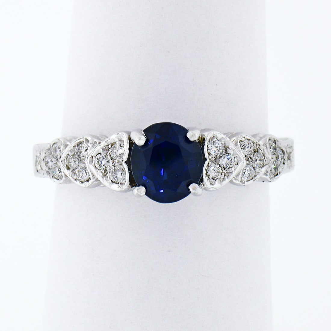 14K White Gold 1.36ct GIA Oval Sapphire Diamond Heart Engagement Ring: 14K White Gold 1.36ct GIA Oval Sapphire Diamond Heart Engagement Ring This stunning engagement ring features a breathtaking GIA certified oval cut natural sapphire, weighing 1.14 carats, set in a soli