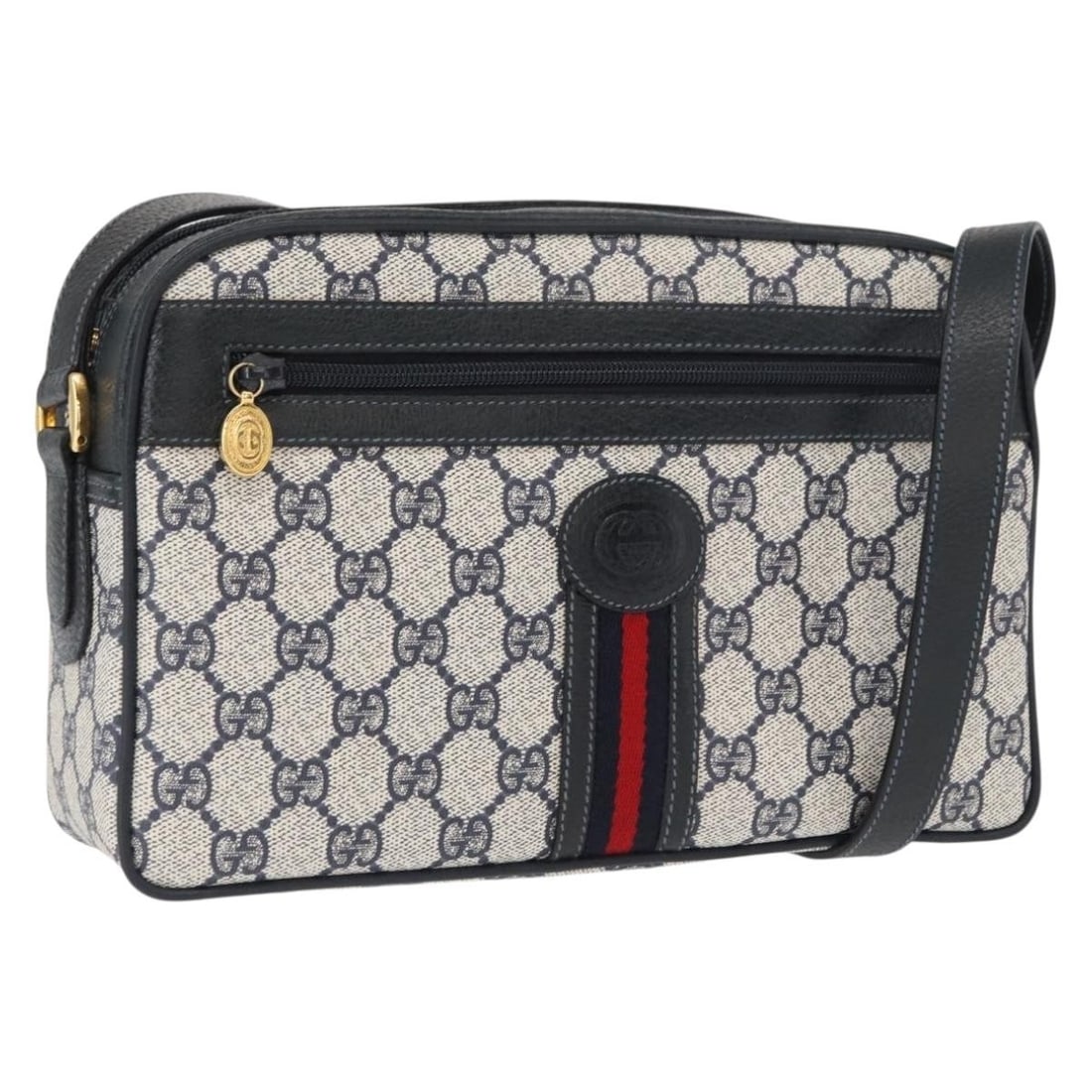 Navy PVC GG Supreme Sherry Line Shoulder Bag by Gucci with Gold and Red Accents: Navy PVC GG Supreme Sherry Line Shoulder Bag by Gucci with Gold and Red Accents This is a Gucci GG Supreme Sherry Line shoulder bag crafted from PVC leather and GG canvas in navy, gold, and red. The b