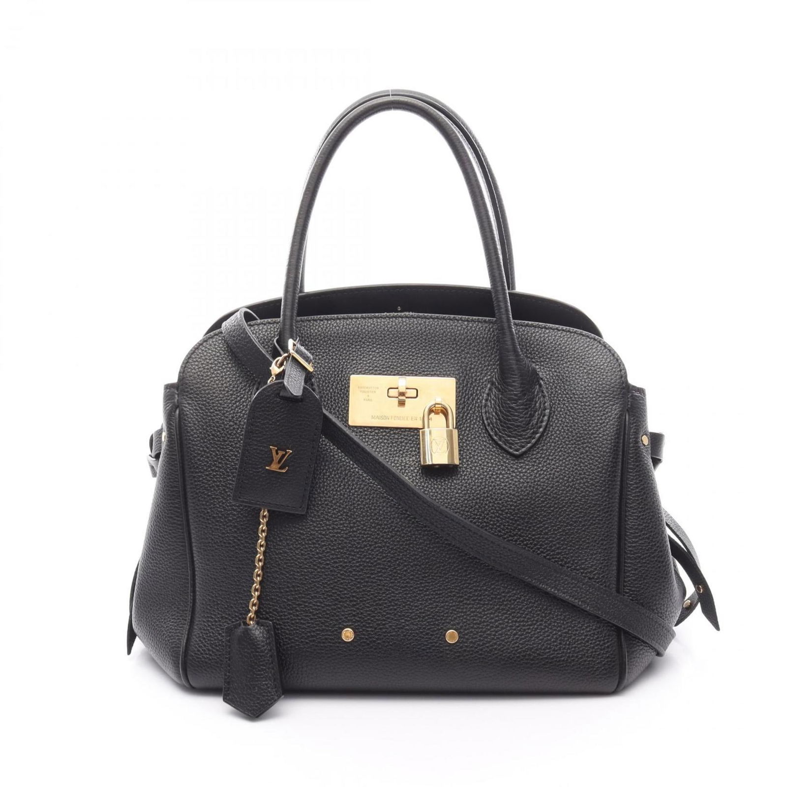 Black Leather Milla Handbag by Louis Vuitton: Black Leather Milla Handbag by Louis Vuitton The Louis Vuitton Milla is a women's handbag crafted from black leather. It features a spacious interior and is designed with both style and practicality i