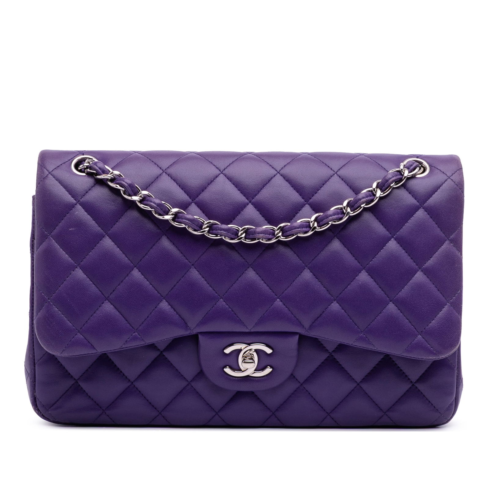 Chanel Jumbo Classic Double Flap Purple Lambskin Shoulder Bag: Chanel Jumbo Classic Double Flap Purple Lambskin Shoulder Bag Introducing the Chanel Jumbo Classic Lambskin Double Flap, a luxurious shoulder bag crafted from exquisite quilted lambskin leather. This