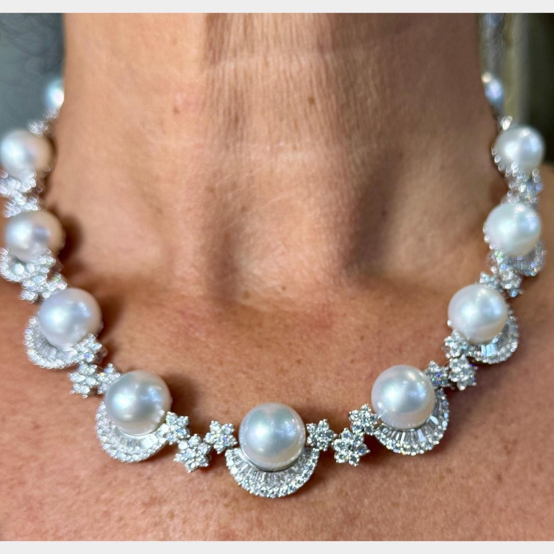 South Sea Pearl and Diamond Necklace in 18K White Gold with 15 Pearls: South Sea Pearl and Diamond Necklace in 18K White Gold with 15 Pearls This exquisite necklace is crafted from 18K white gold and features 15 South Sea pearls, each measuring 13.9mm. The necklace is ad