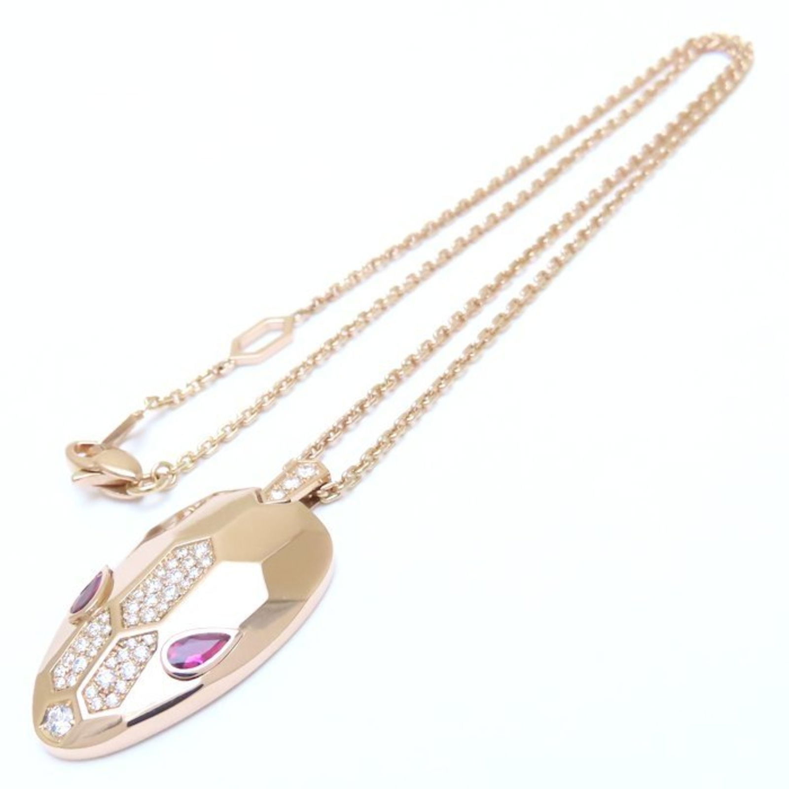 Rose Gold Bulgari Serpenti Necklace Italian Jewelry Design: Rose Gold Bulgari Serpenti Necklace Italian Jewelry Design This Bulgari Serpenti piece is crafted from rose gold and showcases an elegant gold color. Designed for women, it features subtle serpent-ins