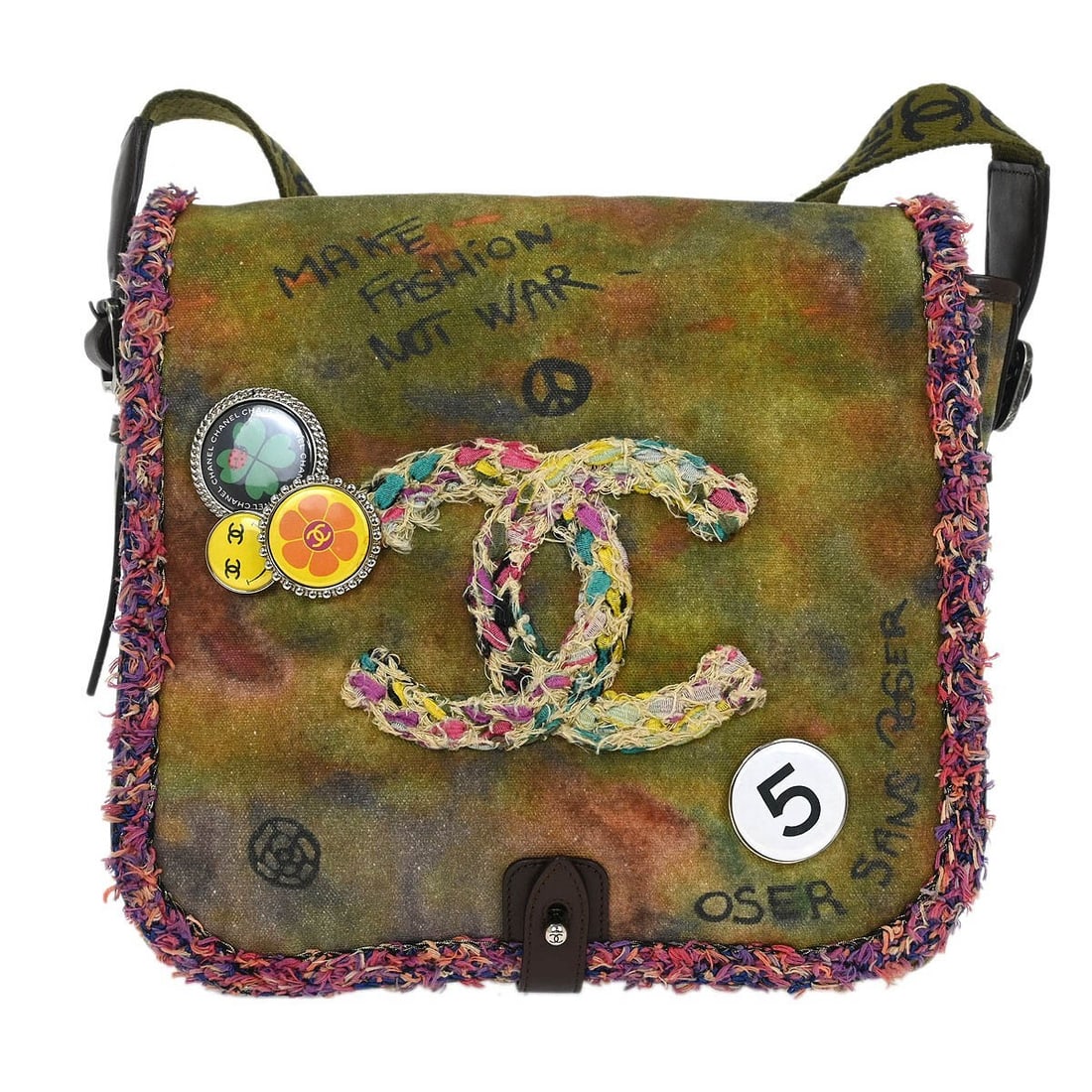 Chanel Khaki Canvas On The Pavements Shoulder Bag: Chanel Khaki Canvas On The Pavements Shoulder Bag This stylish Chanel shoulder bag in khaki canvas features a unique graffiti design from the On The Pavements collection. Designed for convenience, it