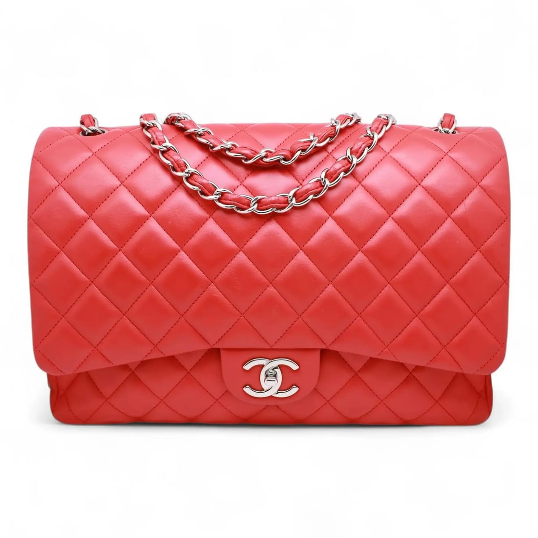 Chanel Classic Jumbo Double Flap Red Lambskin Handbag with Silver Tone Hardware: Chanel Classic Jumbo Double Flap Red Lambskin Handbag with Silver Tone Hardware This Chanel Classic Jumbo Double Flap Handbag is a stunning accessory crafted from vibrant red lambskin leather, accente