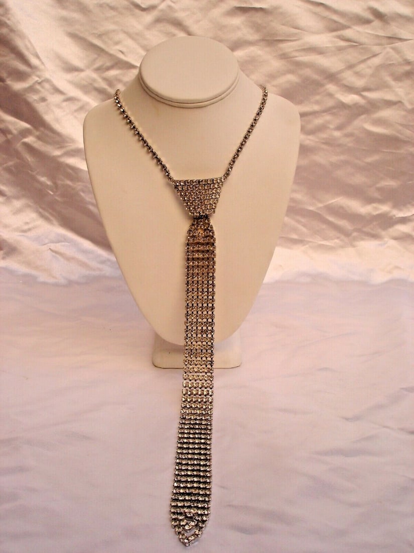 Elizabeth Taylor Inspired Rhinestone Tie Necklace: Elizabeth Taylor Inspired Rhinestone Tie Necklace This exquisite fun tie necklace is a unique piece inspired by the elegant style of Elizabeth Taylor. Crafted from silver tone metal, it features a str
