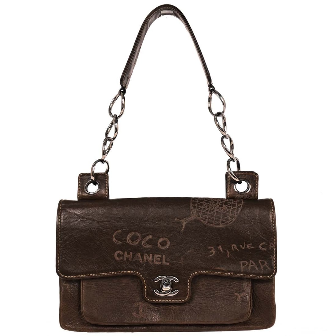 Chanel Brown Quilted Calfskin Top Handle Handbag: Chanel Brown Quilted Calfskin Top Handle Handbag This elegant Chanel Brown Calfskin Handbag showcases a sophisticated quilted pattern, perfect for casual occasions. Crafted from high-quality leather,