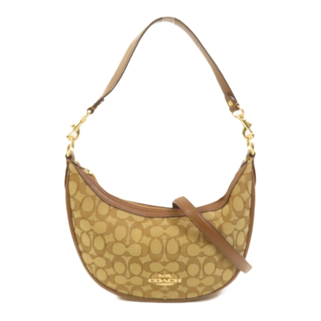 Coach Canvas Brown Shoulder Bag with Gold Tone Hardware: Coach Canvas Brown Shoulder Bag with Gold Tone Hardware This COACH 2-way shoulder bag features a brown canvas exterior with a versatile design that can be worn as a shoulder or crossbody bag. Crafted