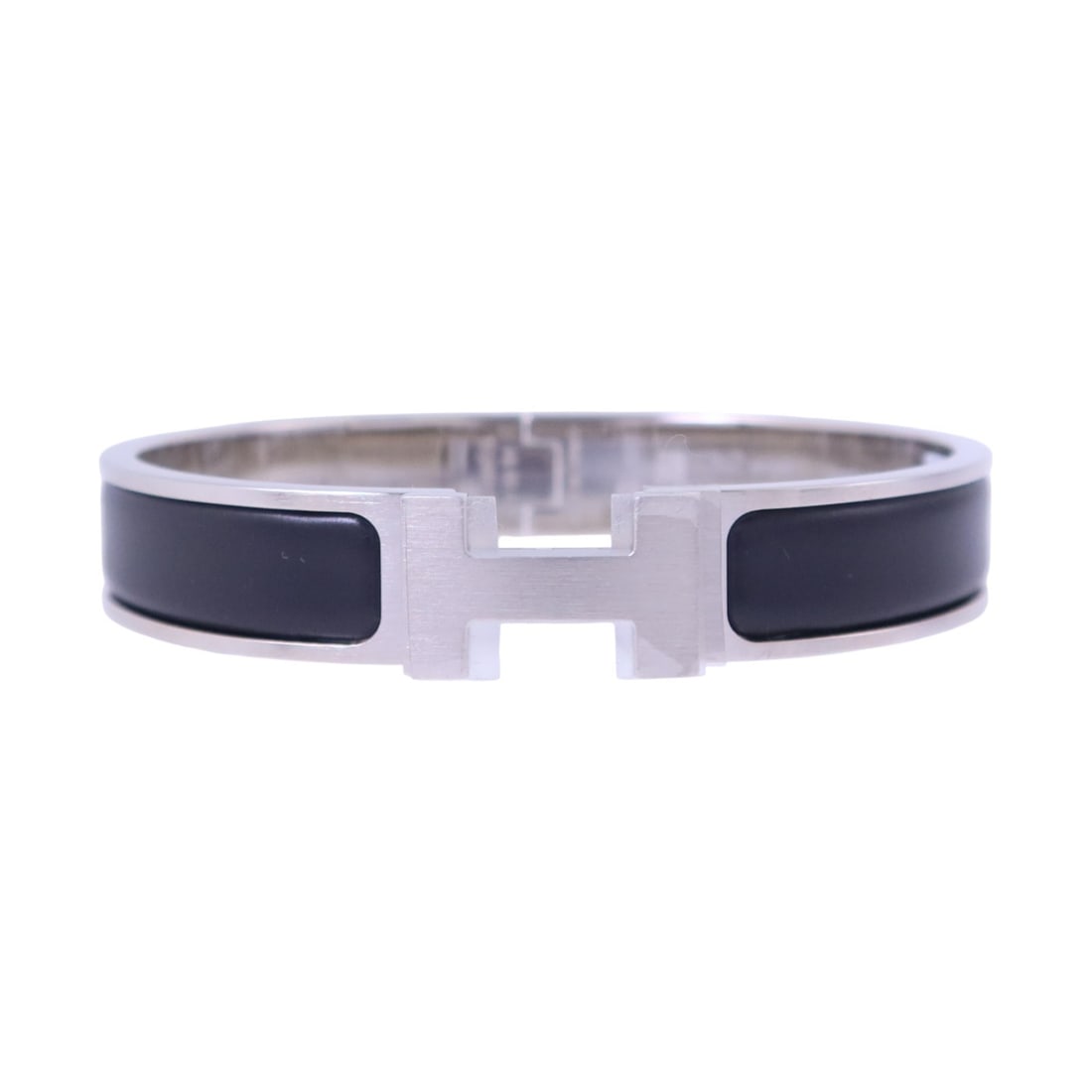 Black Enamel Clic H Bangle Bracelet by Hermes with Palladium Hardware: Black Enamel Clic H Bangle Bracelet by Hermes with Palladium Hardware This Hermes Clic H bracelet features black enamel with silver-tone metal accents. Crafted in France, it is designed in a classic b