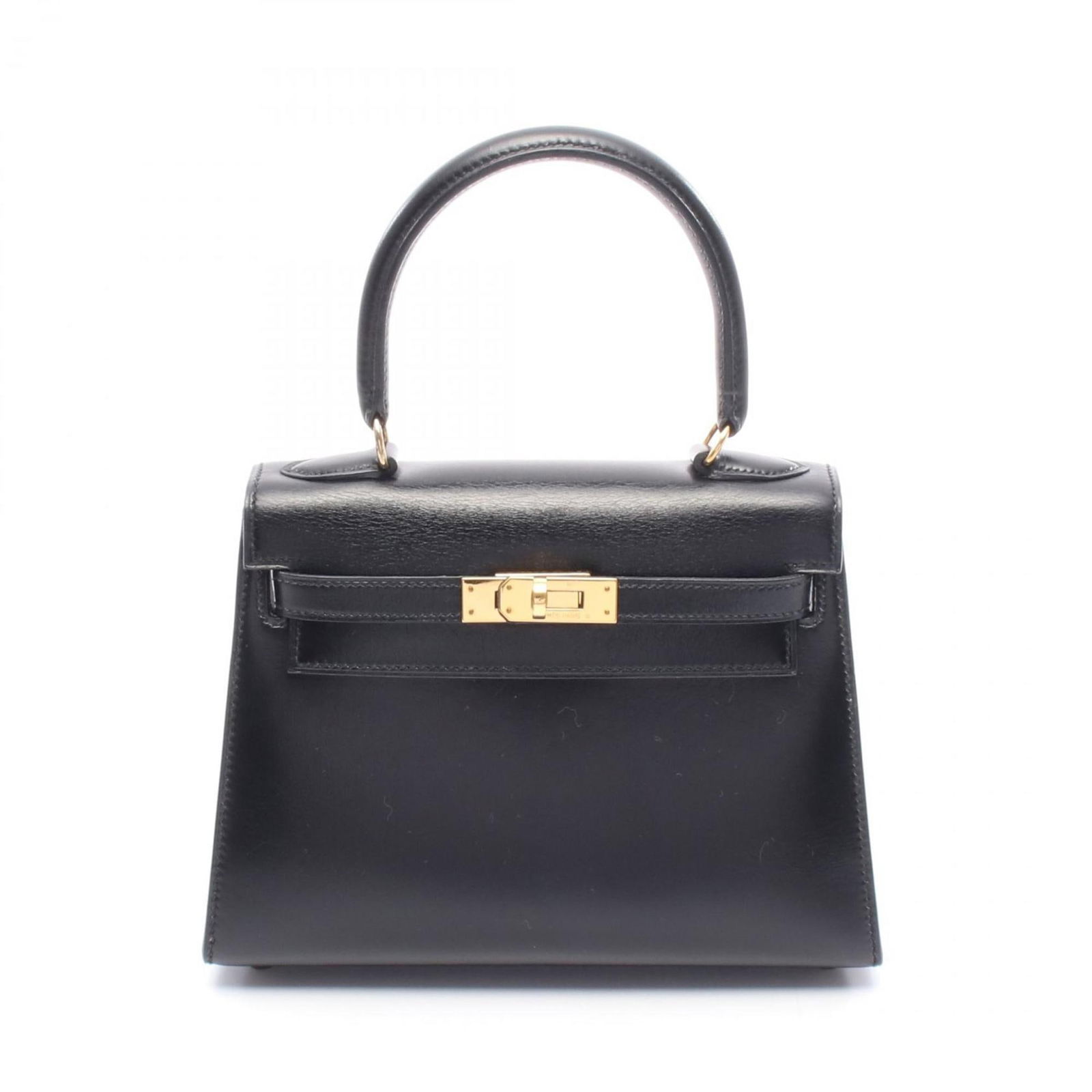 Black Leather Hermes Kelly Bag 20 cm France: Black Leather Hermes Kelly Bag 20 cm France This Hermes Kelly handbag features a classic black leather exterior, complemented by a structured silhouette. It includes a top handle, a detachable strap,