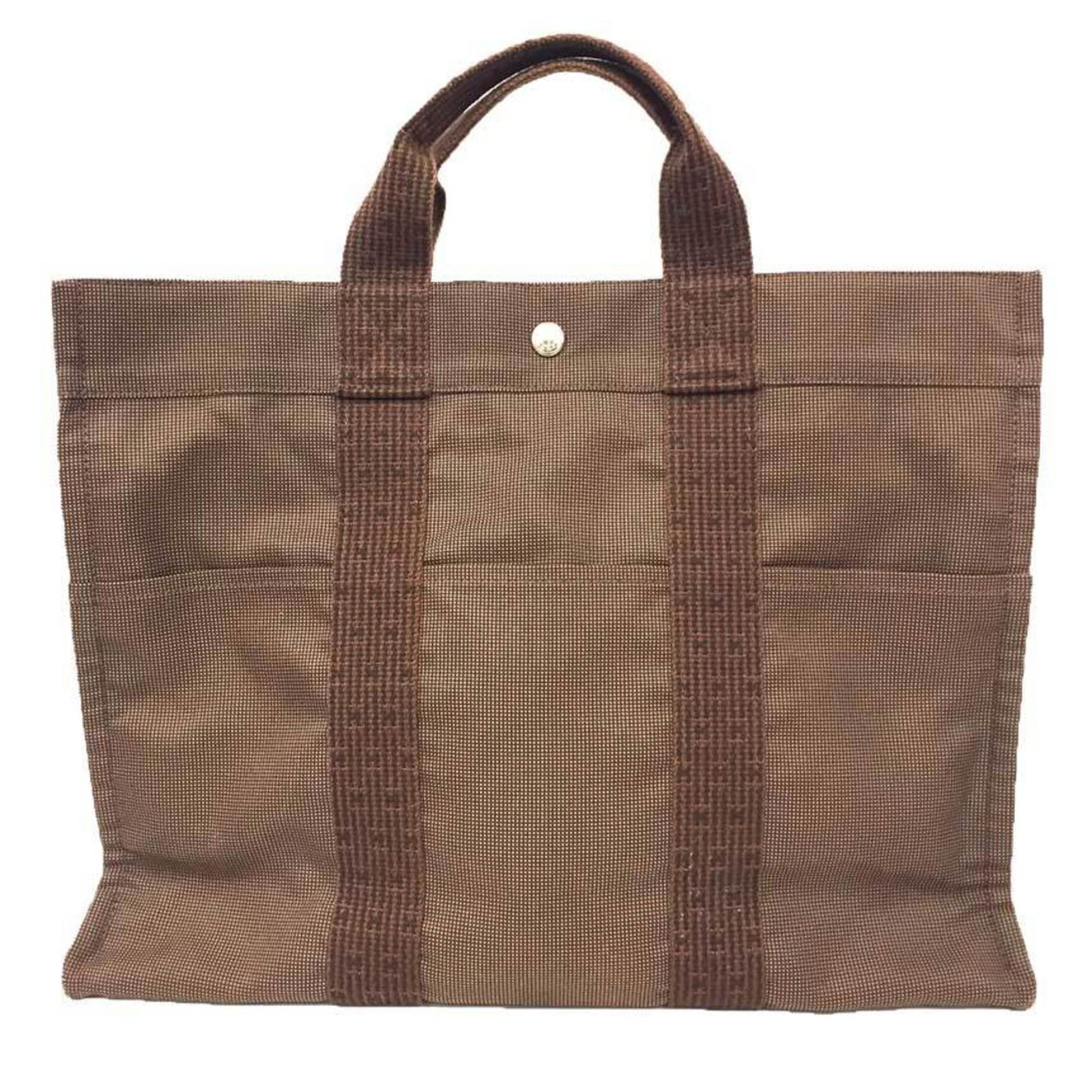 Hermes Herline Brown Canvas Tote Bag Made in France: Hermes Herline Brown Canvas Tote Bag Made in France This Hermes Herline tote bag is crafted from brown canvas and features a spacious design suitable for daily use. Made in France, the bag is