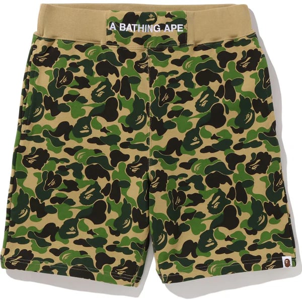 Green ABC Camo Sweatshorts by A Bathing Ape BAPE: Green ABC Camo Sweatshorts by A Bathing Ape BAPE These A Bathing Ape ABC Camo Green Sweatshorts feature the brand's iconic ABC camo pattern in a vibrant green colorway. Made from soft, breathable cott