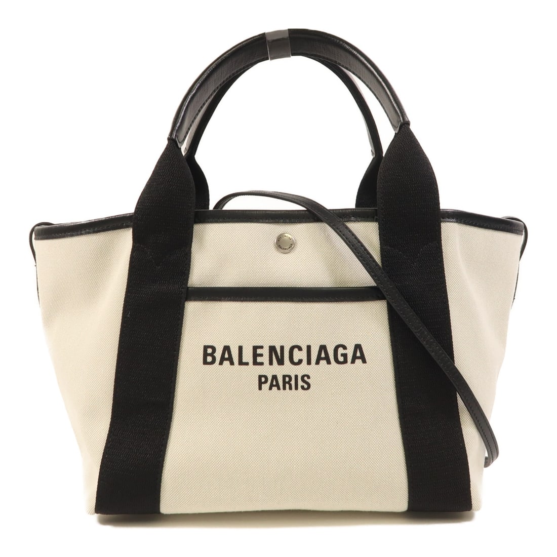 Balenciaga Biarritz Canvas Two Way Shoulder Bag in Ivory and Black: Balenciaga Biarritz Canvas Two Way Shoulder Bag in Ivory and Black This Balenciaga Biarritz 2-way shoulder bag features an ivory and black canvas exterior. Designed for versatility, it can be worn as