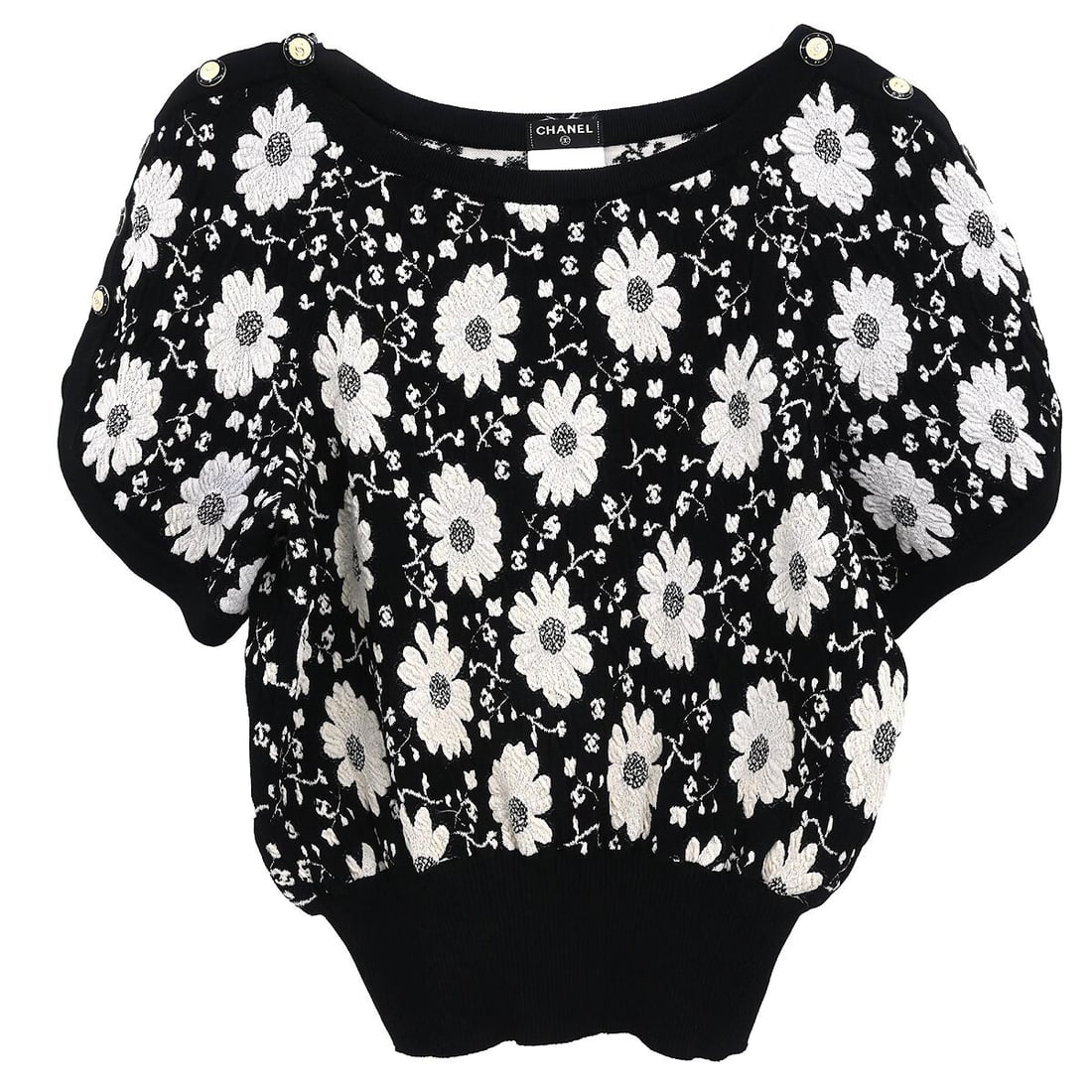 Chanel Black Short Sleeve Top P47650K06085 Size #34: Chanel Black Short Sleeve Top P47650K06085 Size #34 Elevate your casual wardrobe with this stylish Chanel short sleeve top in classic black. Featuring a round neckline and crafted from a blend of 47%