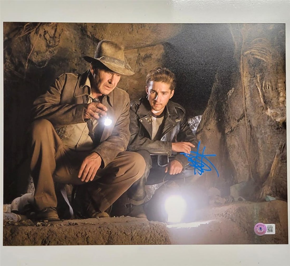 Shia LaBeouf Signed Indiana Jones 11x14 Photo Beckett Authenticated: Shia LaBeouf Signed Indiana Jones 11x14 Photo Beckett Authenticated This original 11x14 photograph from the movie "Indiana Jones and the Kingdom of the Crystal Skull" features the signature of Shia La