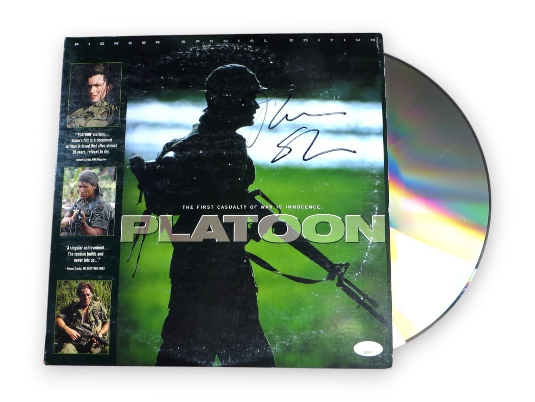 Oliver Stone Autographed Platoon Laserdisc Cover JSA Certified: Oliver Stone Autographed Platoon Laserdisc Cover JSA Certified This is an original laserdisc cover of the film 'Platoon' signed by director Oliver Stone. The item includes the laserdisc(s), although t