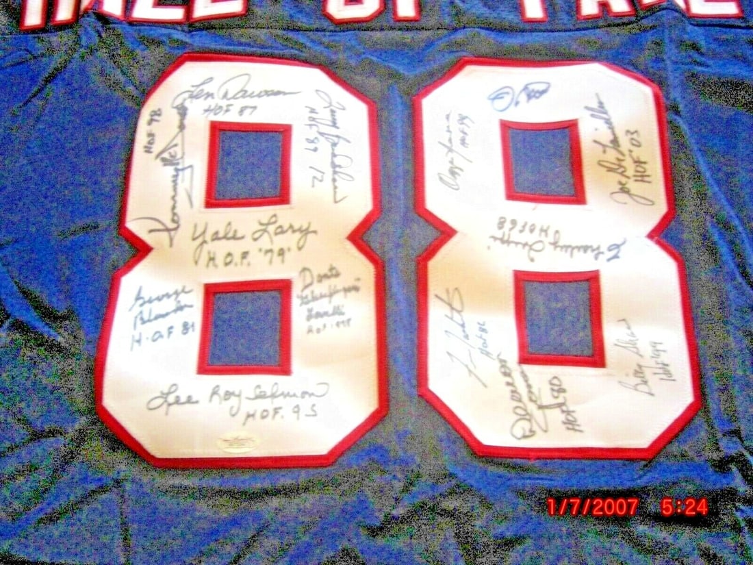 Signed Russell NFL Jersey with Bradshaw Montana and Blanda JSA COA: Signed Russell NFL Jersey with Bradshaw Montana and Blanda JSA COA This official Russell football jersey has been personally signed by Terry Bradshaw, Joe Montana, and George Blanda. It is an original