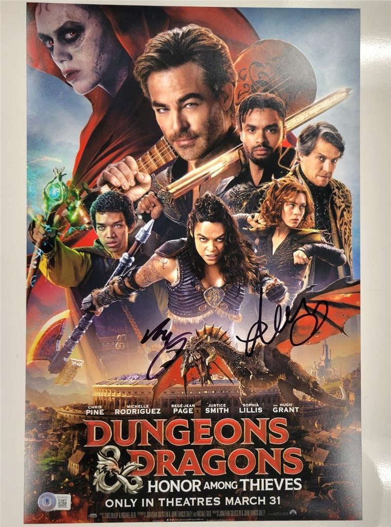 Michelle Rodriguez Signed Dungeons & Dragons 11x17 Photo BAS Authenticated: Michelle Rodriguez Signed Dungeons & Dragons 11x17 Photo BAS Authenticated This original 11x17 photograph features the signatures of Michelle Rodriguez and Daisy Head, captured during the film 'Dungeo