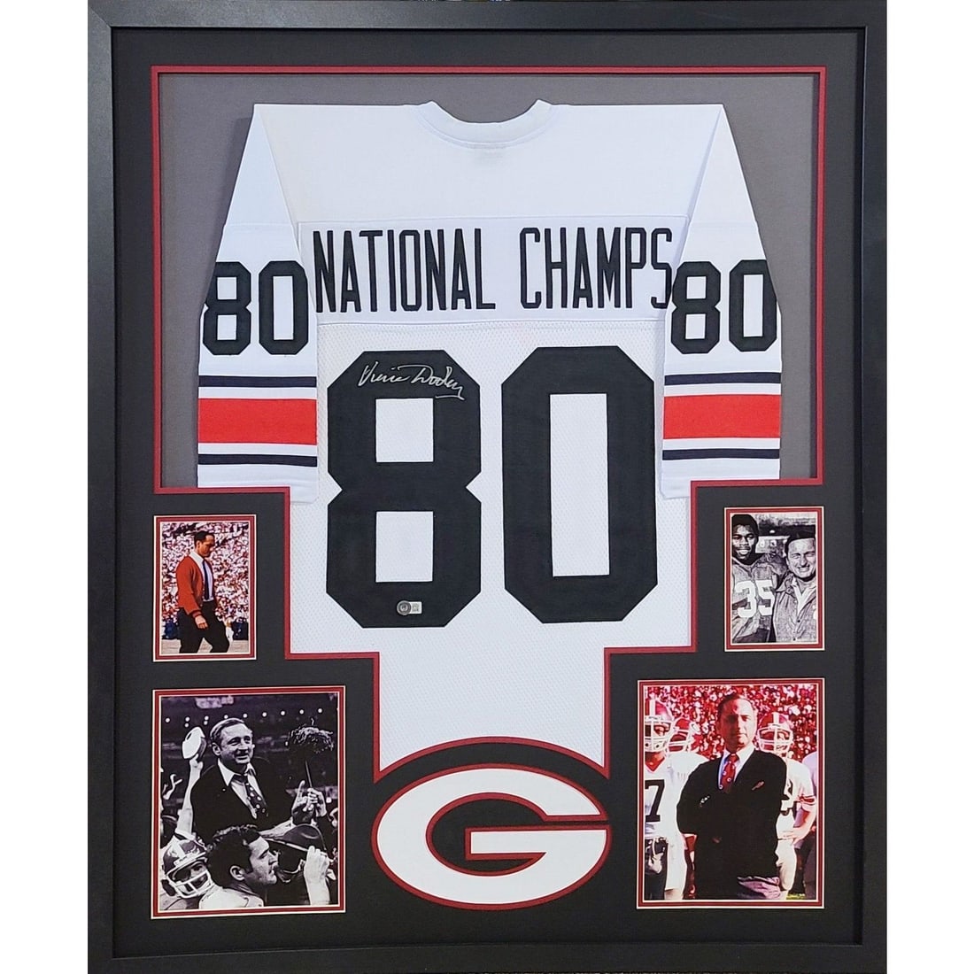 Vince Dooley Signed Framed Jersey Beckett Authenticated Georgia 1980 Champions: Vince Dooley Signed Framed Jersey Beckett Authenticated Georgia 1980 Champions This is a signed framed jersey of Vince Dooley, a tribute to the Georgia 1980 Champions. The jersey is authenticated by B