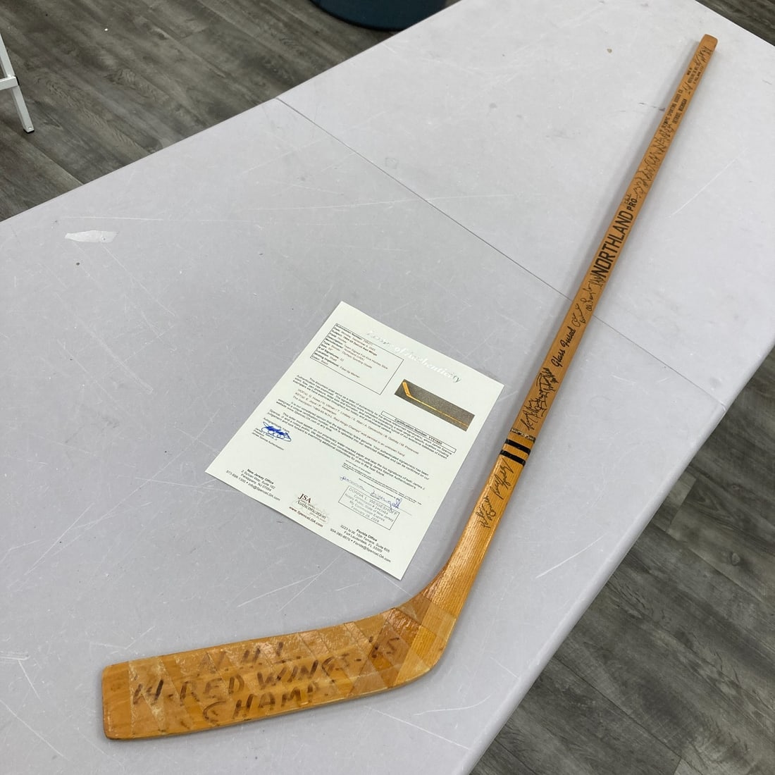 1964-65 Detroit Red Wings Team Signed Gordie Howe Game Issued Stick JSA COA: 1964-65 Detroit Red Wings Team Signed Gordie Howe Game Issued Stick JSA COA This is a game-issued Northland model hockey stick from the legendary Gordie Howe, a key player for the Detroit Red Wings. T