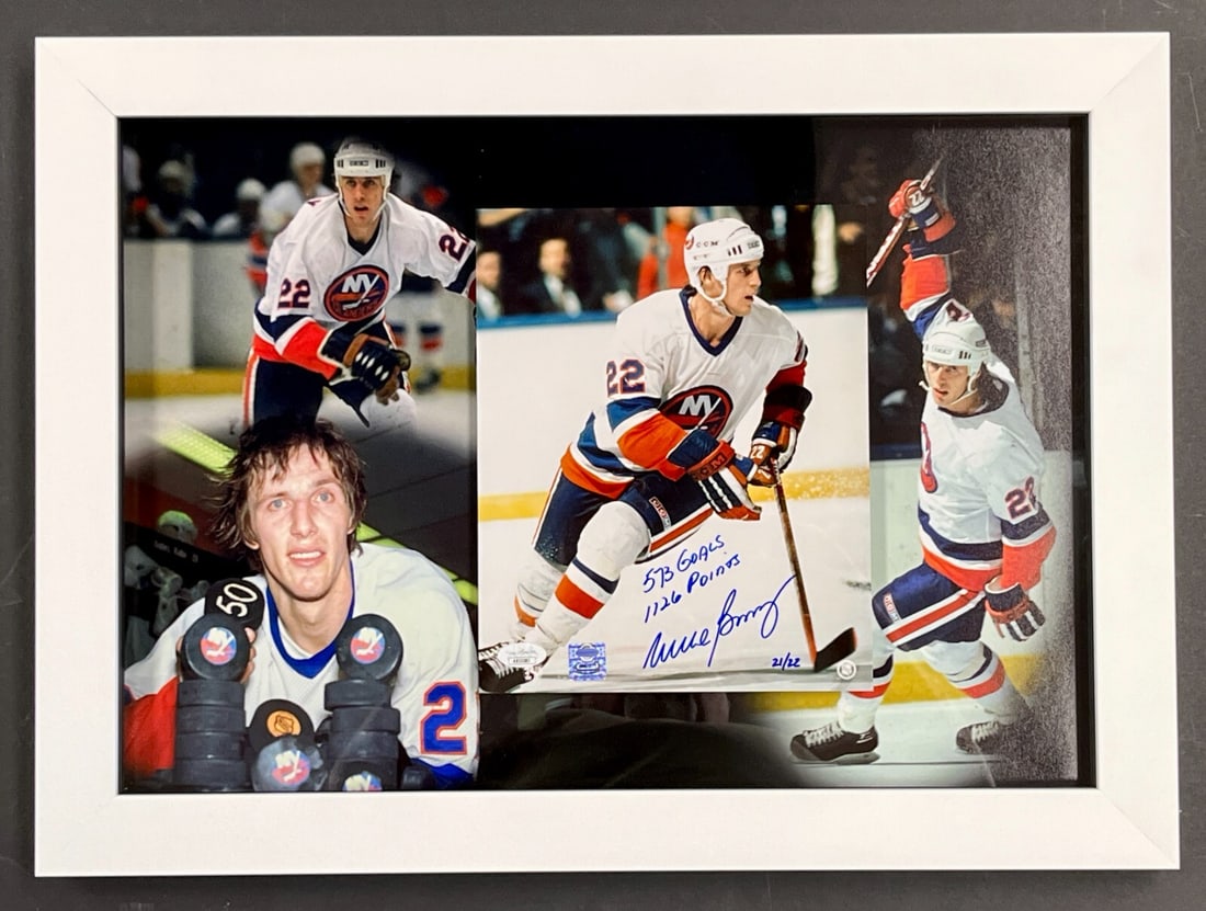 Mike Bossy Signed 8x10 Photo Display 573 Goals 1126 Points JSA Authenticated: Mike Bossy Signed 8x10 Photo Display 573 Goals 1126 Points JSA Authenticated Celebrate the legacy of hockey legend Mike Bossy with this stunning custom framed display. This limited edition 8x10 photo