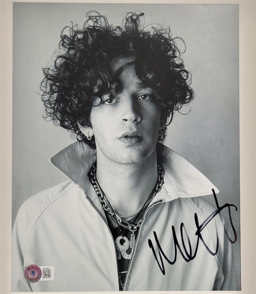 8x10 Matty Healy Signed Photo from The 1975 with Beckett Authentication: 8x10 Matty Healy Signed Photo from The 1975 with Beckett Authentication This original 8x10 photograph features an authentic autograph by Matty Healy of The 1975. The signature has been authenticated b