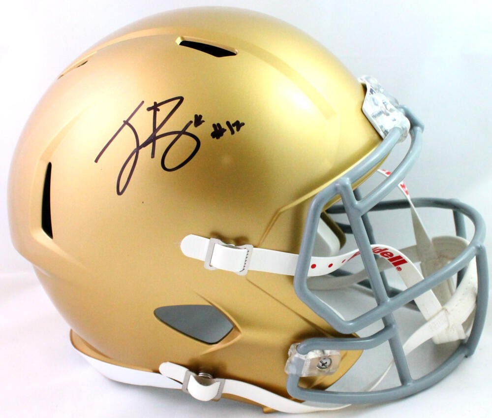 Ian Book Signed Notre Dame Gold Speed Helmet Beckett Authenticated: Ian Book Signed Notre Dame Gold Speed Helmet Beckett Authenticated This is a full-size gold speed helmet representing the Notre Dame Fighting Irish, autographed by quarterback Ian Book. The helmet is