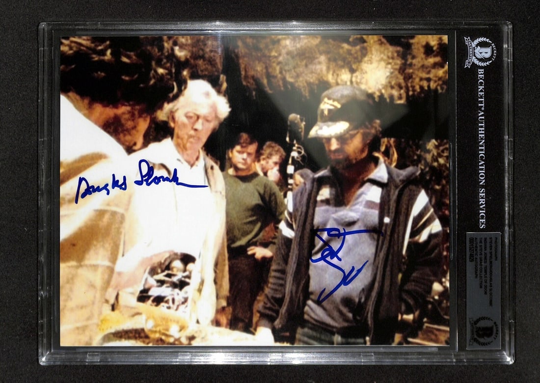 Autographed 8x10 Indiana Jones Photo Spielberg Slocombe Beckett Authenticated: Autographed 8x10 Indiana Jones Photo Spielberg Slocombe Beckett Authenticated This is an original 8x10 color photograph from Raiders of the Lost Ark, signed in blue permanent marker by Steven Spielber